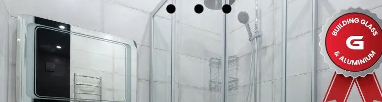 Frameless glass shower enclosure